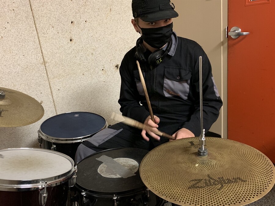 Picture of a student playing the drums