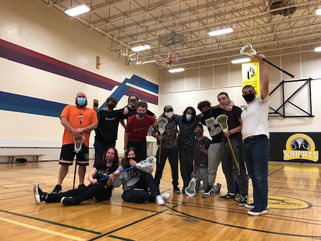 Indigenous studies playing lacrosse