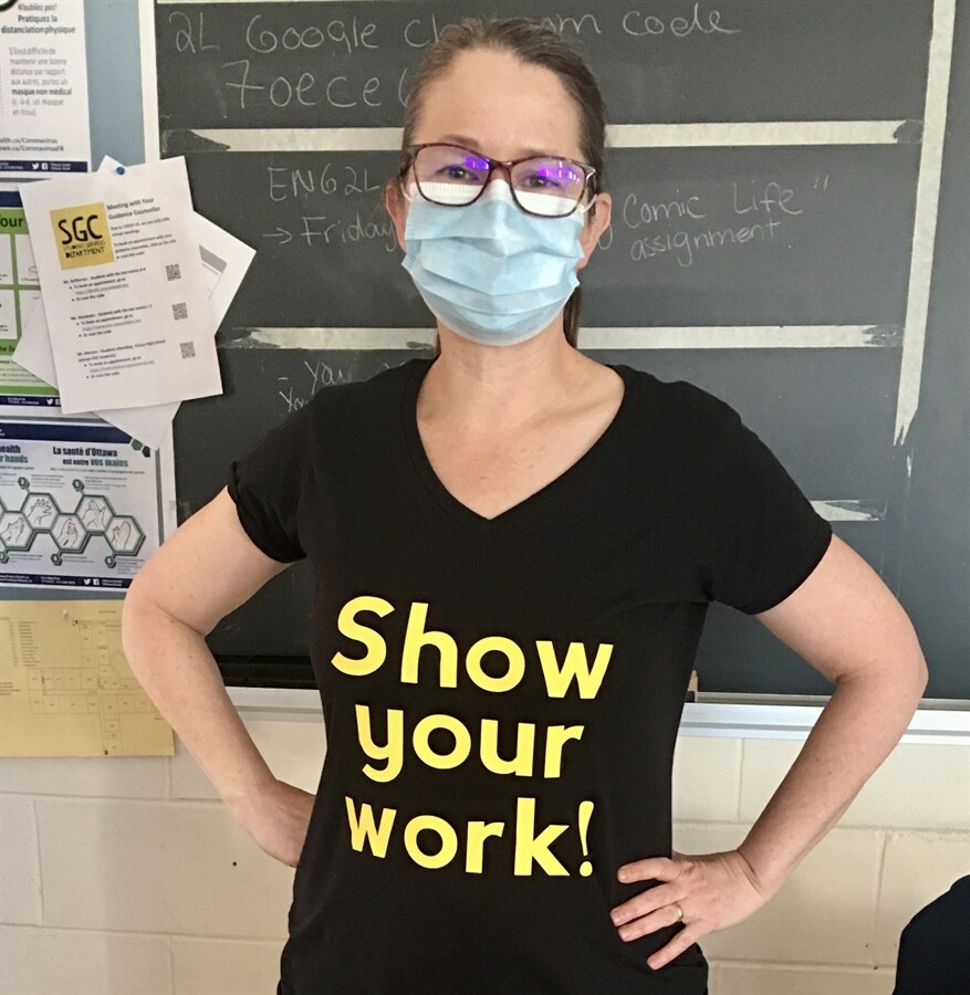 picture of a math teacher with a shirt that says "Show your work"